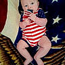 Ethan joined the competition — help win amazing prizes! baby, child, infant, onesie, american_flag, blanket, stars, red, white, blue, chewing, cute, portrait, lying_down, hand, foot, skin, face, expression, pattern