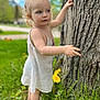 barefoot, child, closeup, curly_hair, dandelion, daylight, dress, exploration, flower, grass, greenery, nature, outdoor, person, portrait, skin, summer, toddler, tree, young_child