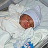 Dwane Jr. is registered to the contest to win money with this photo: newborn, baby, hospital, bassinet, blanket, hat, sleeping, infant, clothing, bed, person, cute, resting, medical, newborn_care, wrapped, soft, peaceful, hospital_room, child