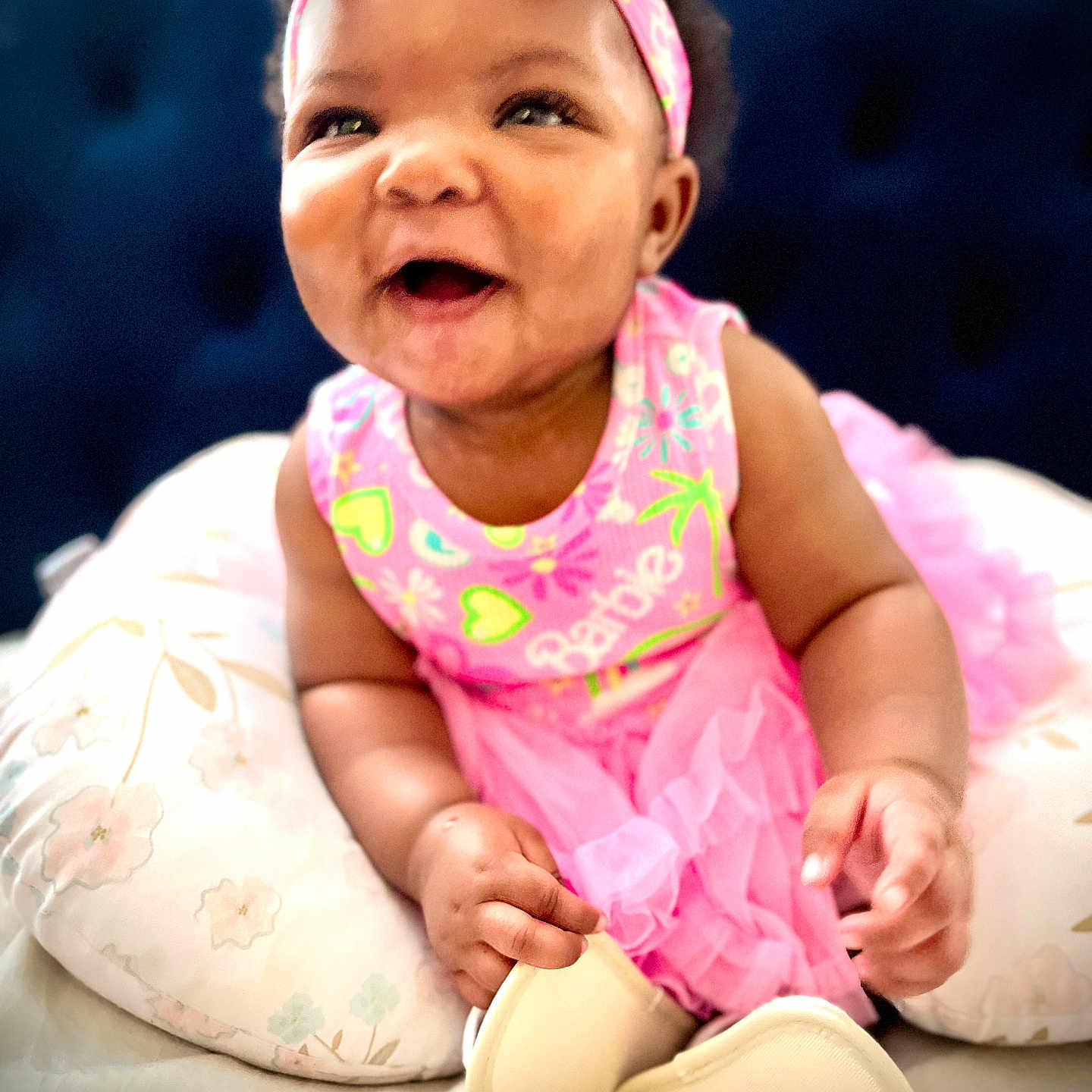Za'Karriyah joined the competition — help win amazing prizes! baby, child, clothing, cushion, cute, dress, girl, happy, headband, indoors, infant, person, pillow, pink, portrait, sitting, skin, smiling, soft, toddler