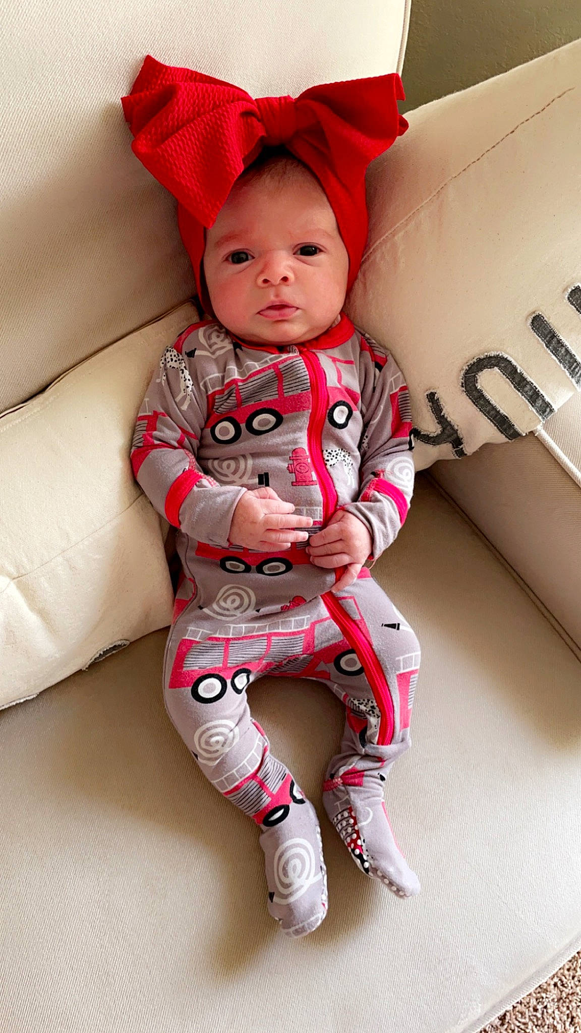 Ali is registered to the contest to win money with this photo: baby, baby_toddler_clothing, child, comfort, eye, face, happy, knee, leg, neck, outerwear, person, pink, red, skin, sleeve, standing, t_shirt, thigh, toddler