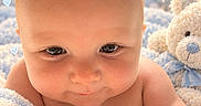 Malachi joined the competition — help win amazing prizes! adorable, baby, blanket, blue, child, close_up, cozy, face, hearts, indoor, infant, lying_down, nursery, plush_toy, portrait, sparkles, teddy_bear, text_overlay, white, wide_eyes