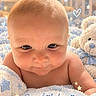Malachi joined the competition — help win amazing prizes! baby, infant, child, portrait, face, wide_eyes, cozy, blanket, teddy_bear, plush_toy, blue, white, close_up, indoor, nursery, lying_down, adorable, sparkles, hearts, text_overlay