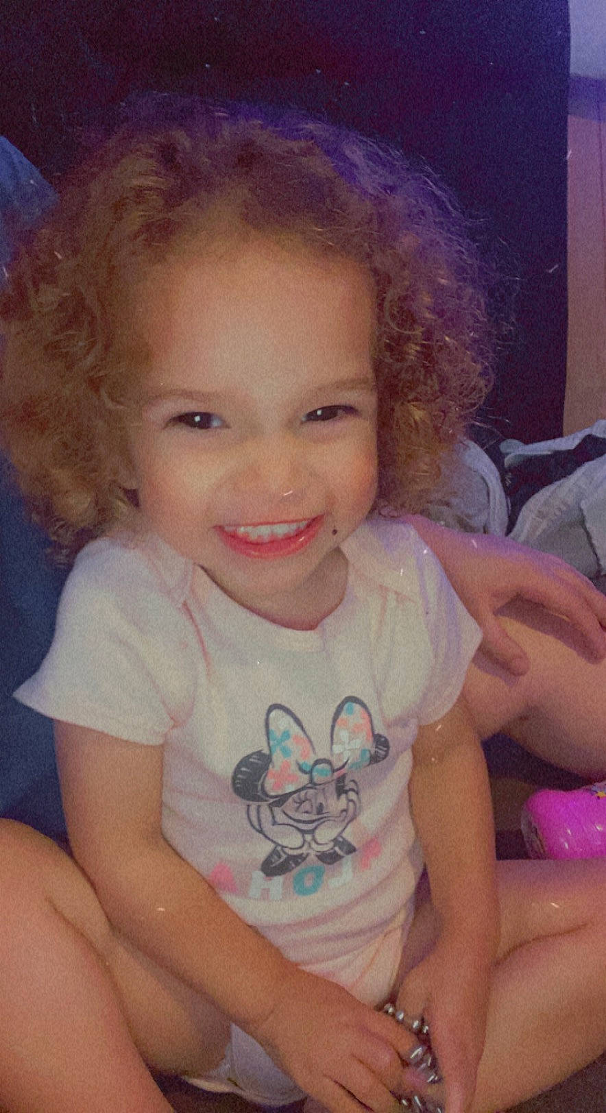 Malia is registered to the contest to win money with this photo: arm, cheek, chin, eye, eyebrow, face, facial_expression, forehead, hair, hairstyle, iris, joy, lip, mouth, neck, nose, person, purple, shoulder, skin