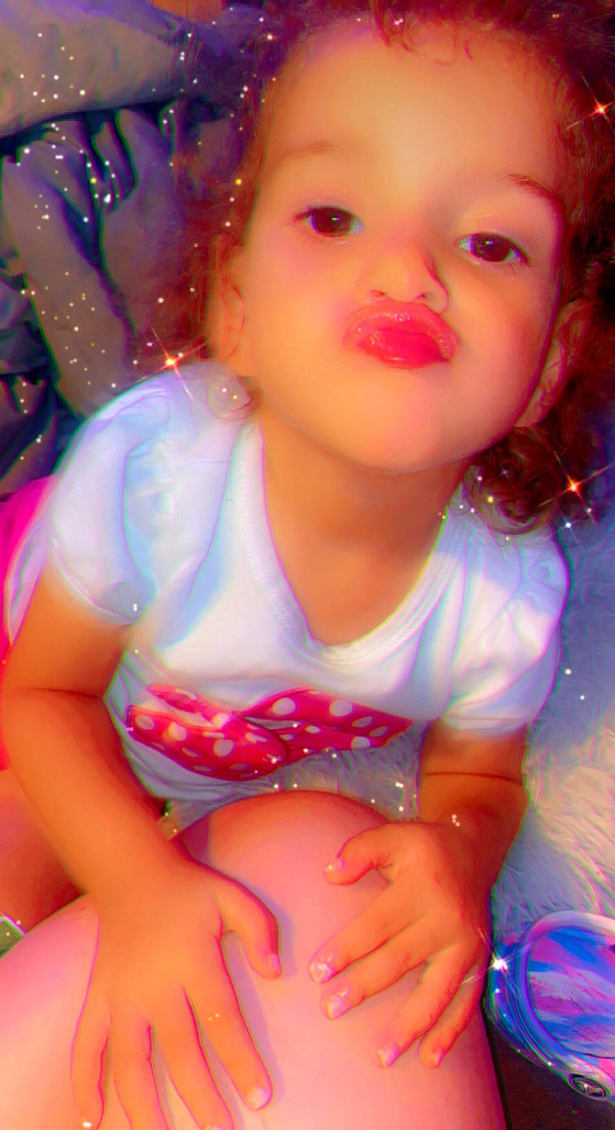 Malia is registered to the contest to win money with this photo: baby_toddler_clothing, beauty, brown_hair, cheek, child, event, eye, face, facial_expression, fun, happy, human_leg, lip, magenta, organ, pattern, person, pink, skin, thigh