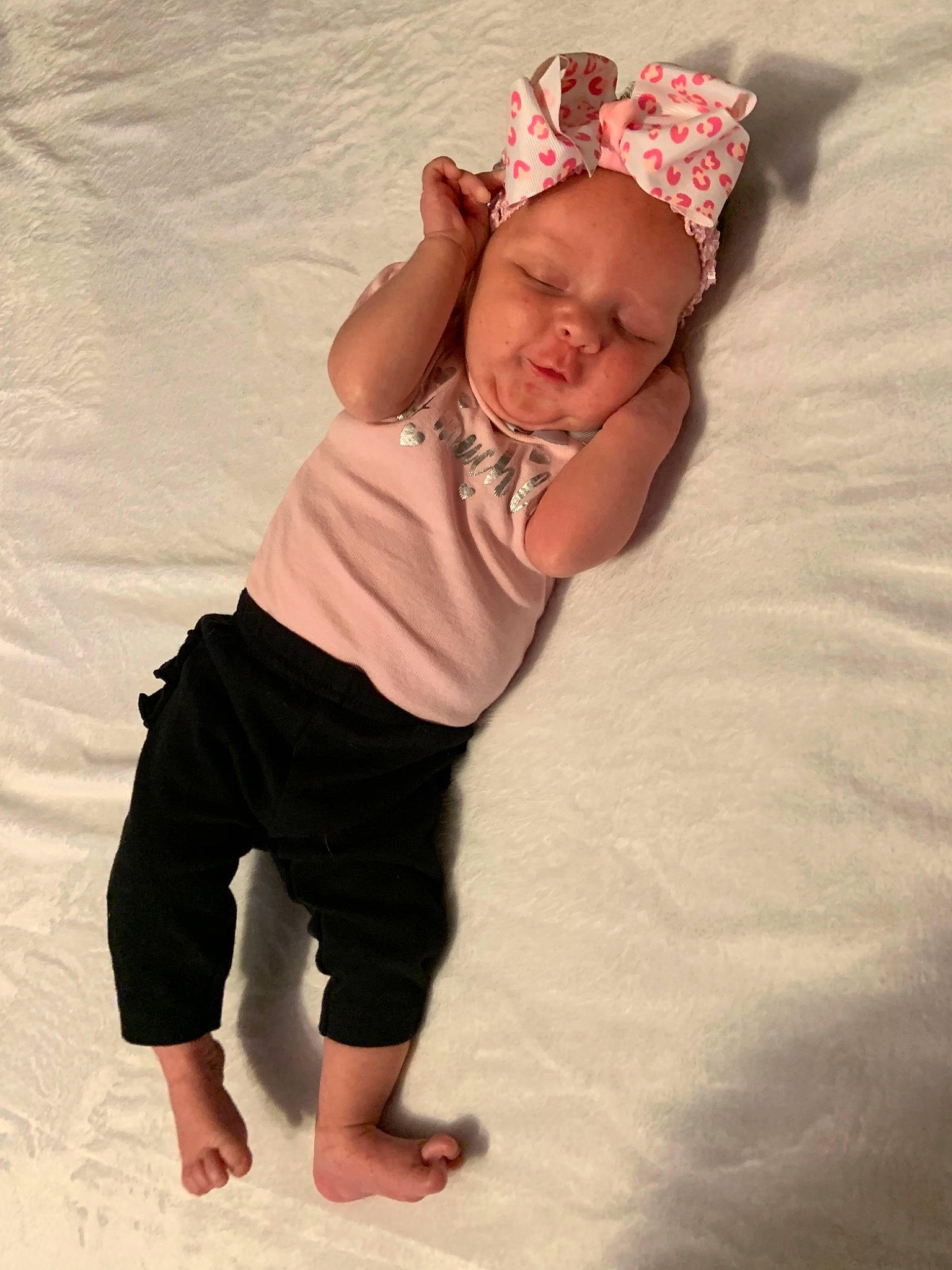 Kenzlee is registered to the contest to win money with this photo: arm, baby, baby_toddler_clothing, barefoot, child, fashion_accessory, fun, hair_accessory, headgear, leg, person, pink, textile, toddler