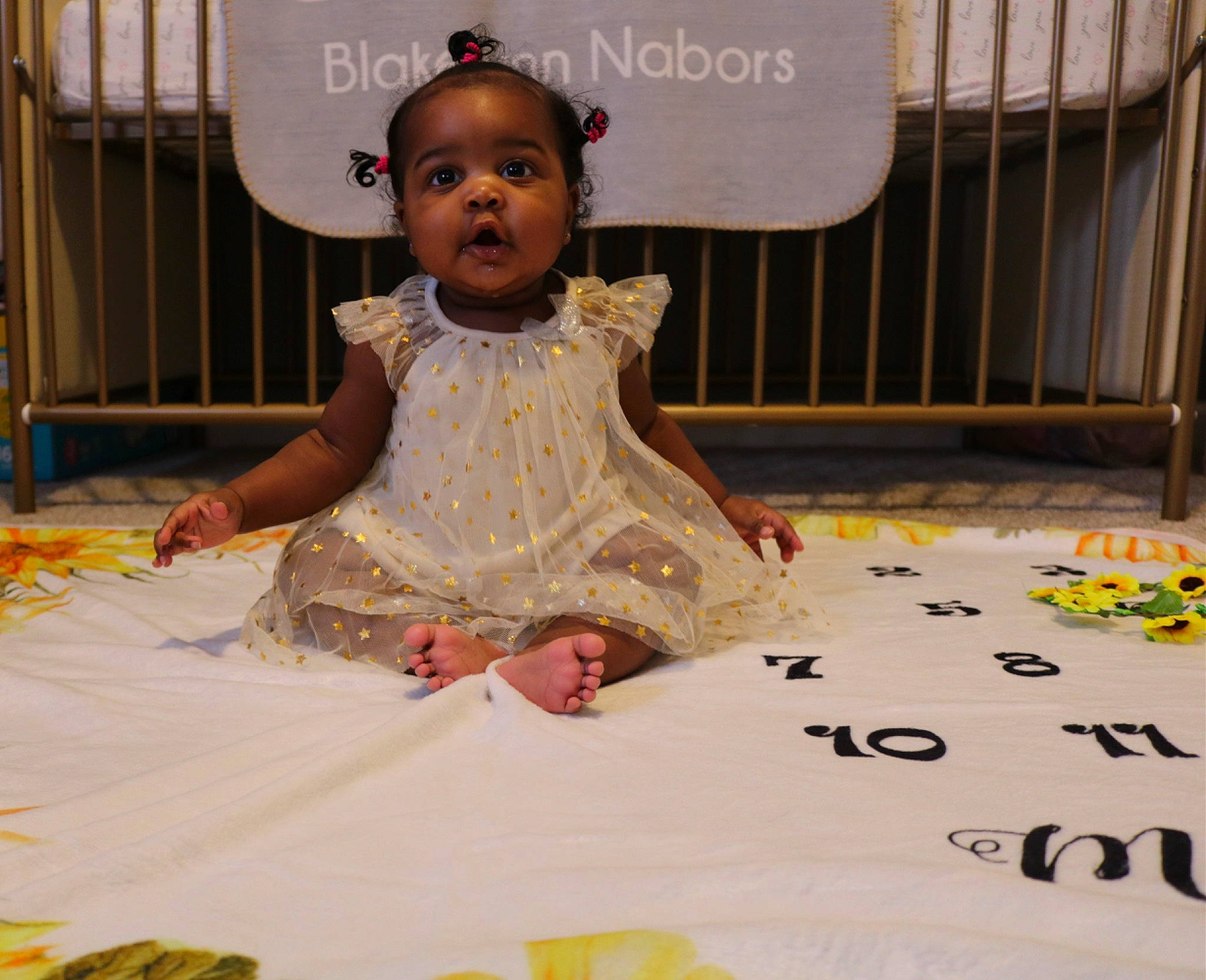 Blakelynn is registered to the contest to win money with this photo: adaptation, baby, baby_toddler_clothing, chair, child, dress, event, eye, fashion_design, flooring, fun, happy, leisure, linens, pattern, people, person, pink, sitting, textile