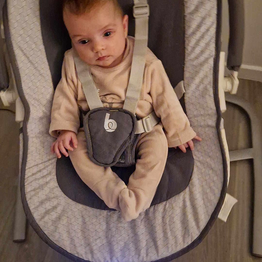 Tyliah participe au concours pour gagner de l'argent avec cette photo : accessories, baby, bed, clothing, cradle, crib, cushion, face, furniture, head, homedecor, infantbed, pants, person, photography, portrait, strap, transportation, vehicle, wood