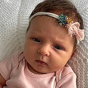Summer joined the competition — help win amazing prizes! baby, infant, face, headband, pink_clothing, blanket, portrait, closeup, cute, child, newborn, soft_lighting, expression, resting, indoors, person, young_child, skin, hair, sleepwear