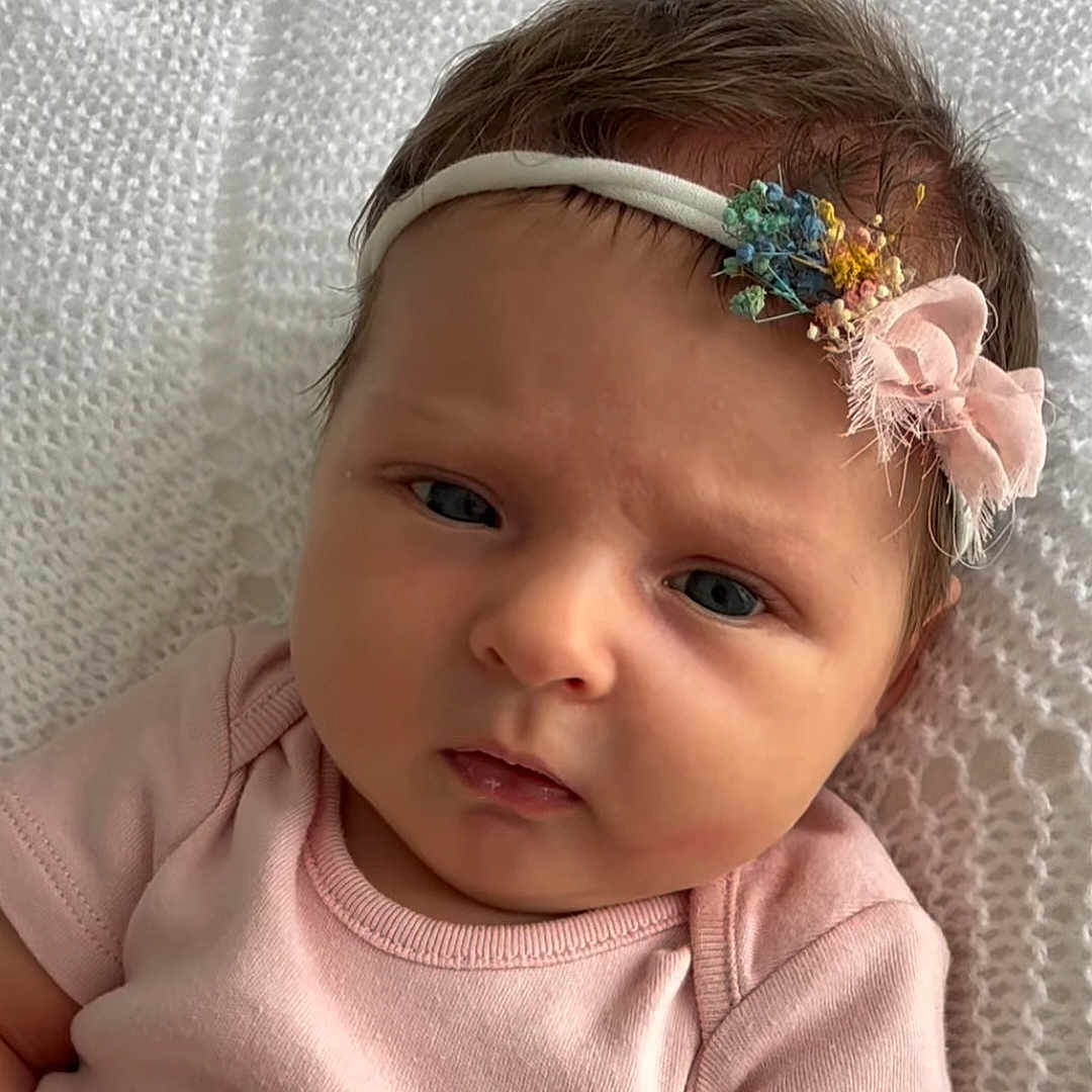 Summer joined the competition — help win amazing prizes! baby, blanket, child, closeup, cute, expression, face, hair, headband, indoors, infant, newborn, person, pink_clothing, portrait, resting, skin, sleepwear, soft_lighting, young_child