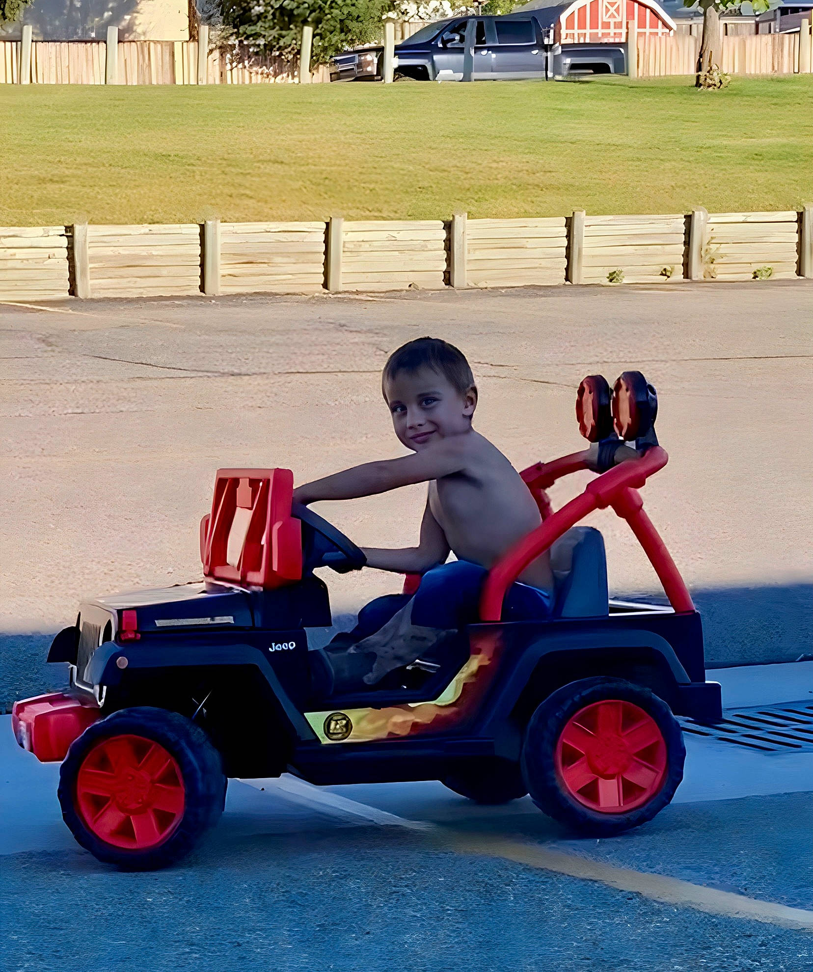 Kyler joined the competition — help win amazing prizes! auto_part, automotive_design, automotive_exterior, automotive_tire, automotive_wheel_system, classic, electric_blue, fence, fender, fun, joy, motor_vehicle, person, riding_toy, rim, rolling, smile, tire, toddler, tread