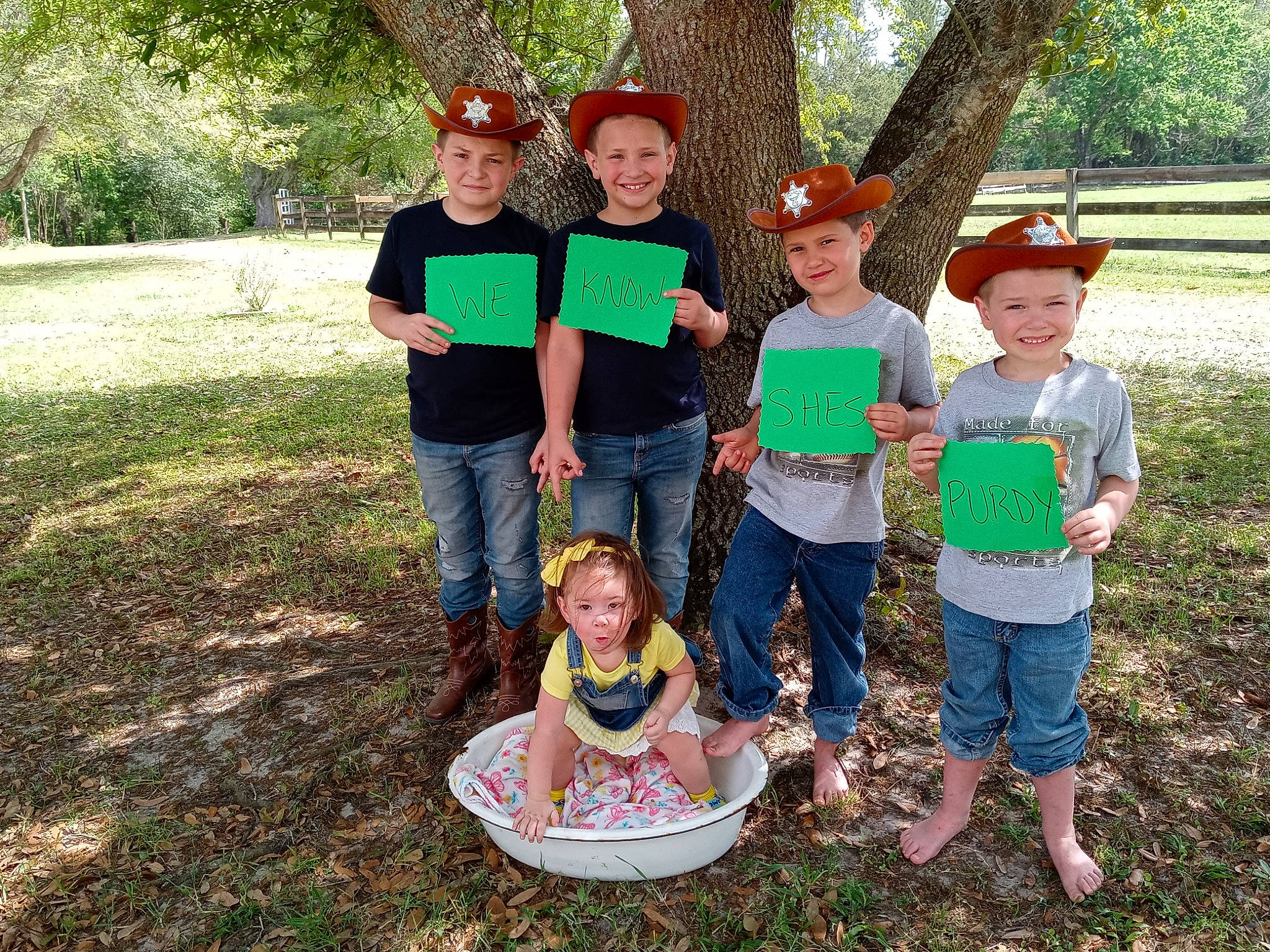 Jasmine is registered to the contest to win money with this photo: botany, community, face, grass, happy, hat, headwear, jeans, joy, leaf, leisure, people_in_nature, person, plant, recreation, sharing, shorts, smile, summer, t_shirt
