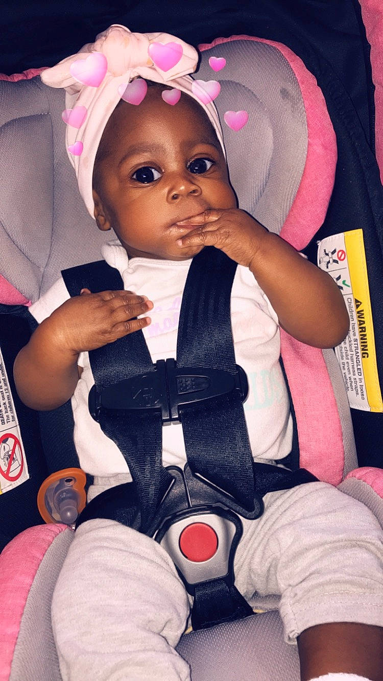 Nakayla is registered to the contest to win money with this photo: auto_part, baby, baby_in_car_seat, car_seat, cheek, child, ear, person, pink, product, seat_belt, toddler