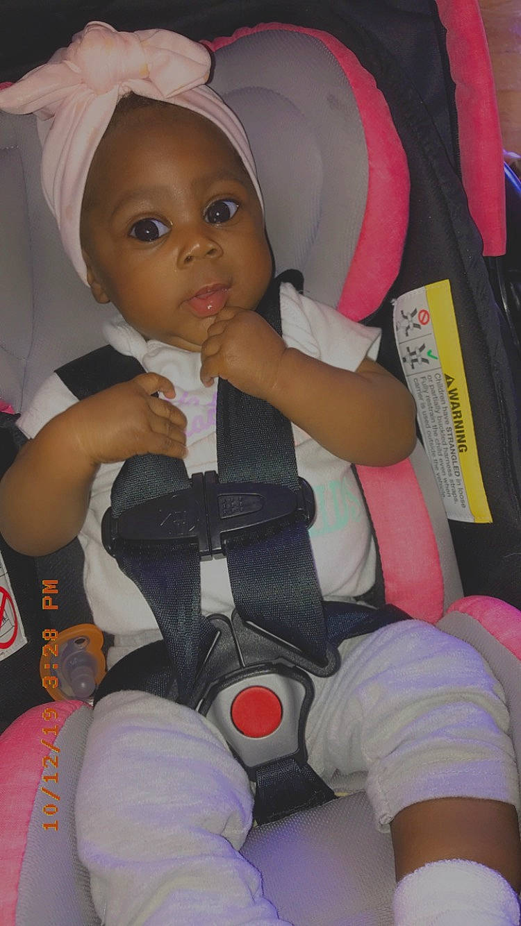 Nakayla is registered to the contest to win money with this photo: car_seat, child, person, toddler