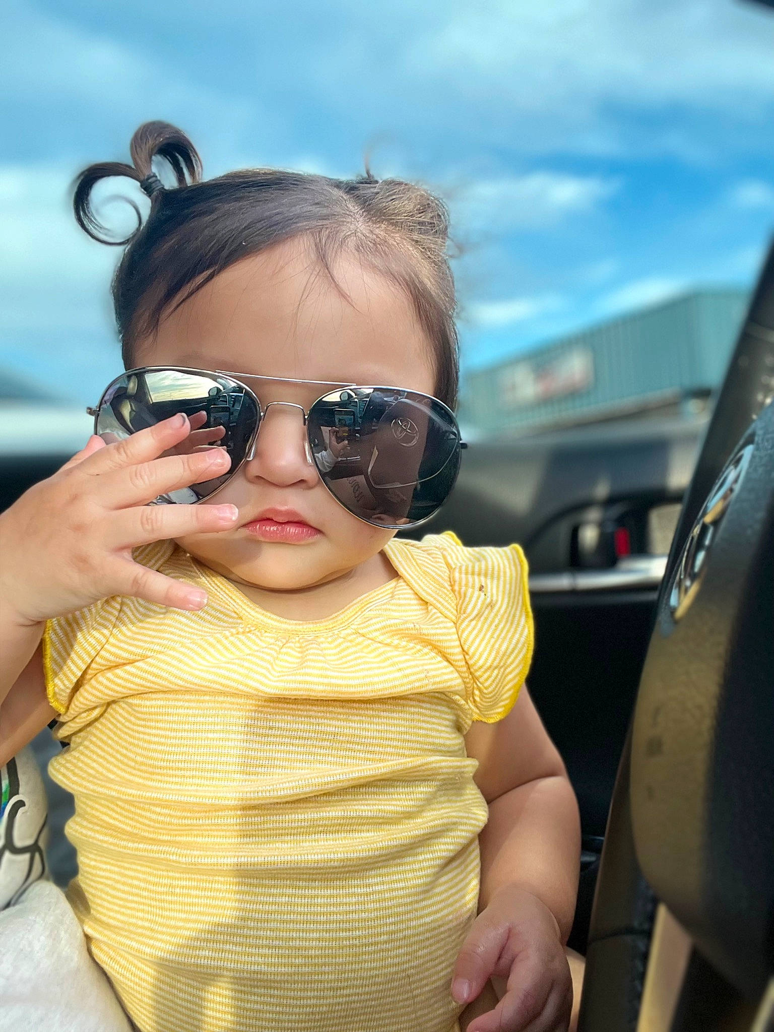 Alaya joined the competition — help win amazing prizes! auto_part, baby, black_hair, child, eyewear, fun, glass, glasses, goggles, happy, leisure, lip, person, personal_protective_equipment, skin, sky, sunglasses, toddler, travel, vehicle_door