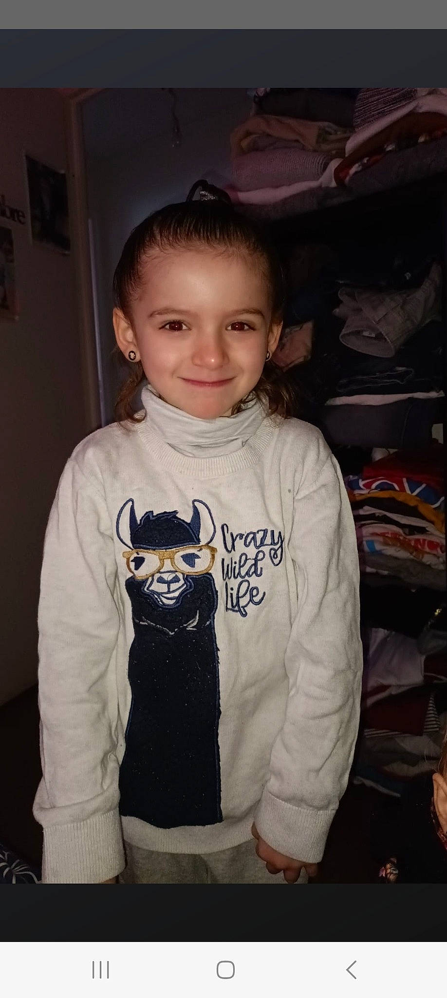 Elena participe au concours pour gagner de l'argent avec cette photo : active_shirt, baby_toddler_clothing, child, cool, flash_photography, font, gadget, hair, happy, head, hood, hoodie, joy, long_sleeved_t_shirt, neck, person, room, sleeve, smile, t_shirt