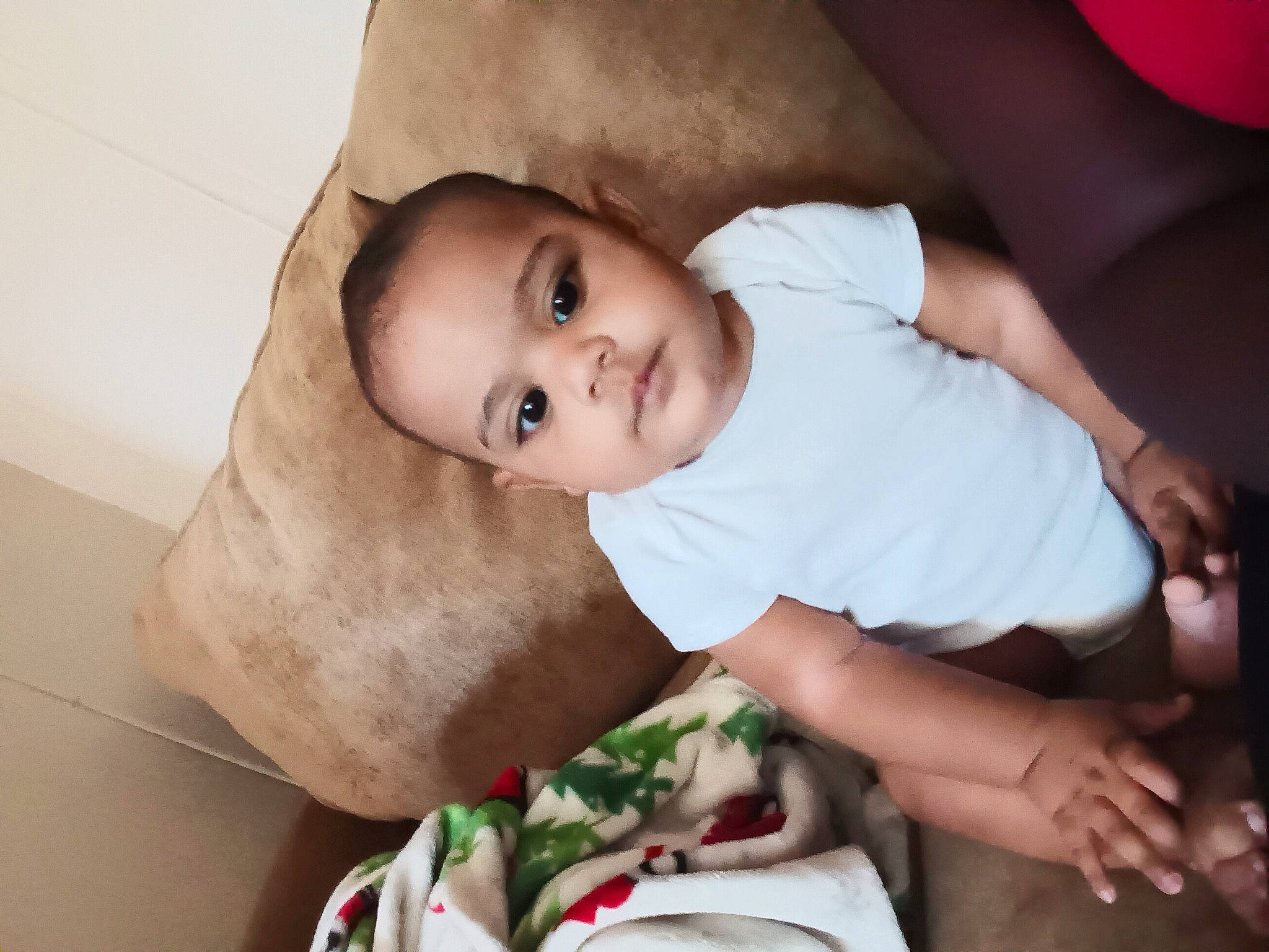 Lawrence is registered to the contest to win money with this photo: baby, baby_toddler_clothing, cheek, child, comfort, elbow, eyelash, flash_photography, fun, happy, hat, human_body, lip, nose, person, sitting, skin, sleeve, smile, toddler