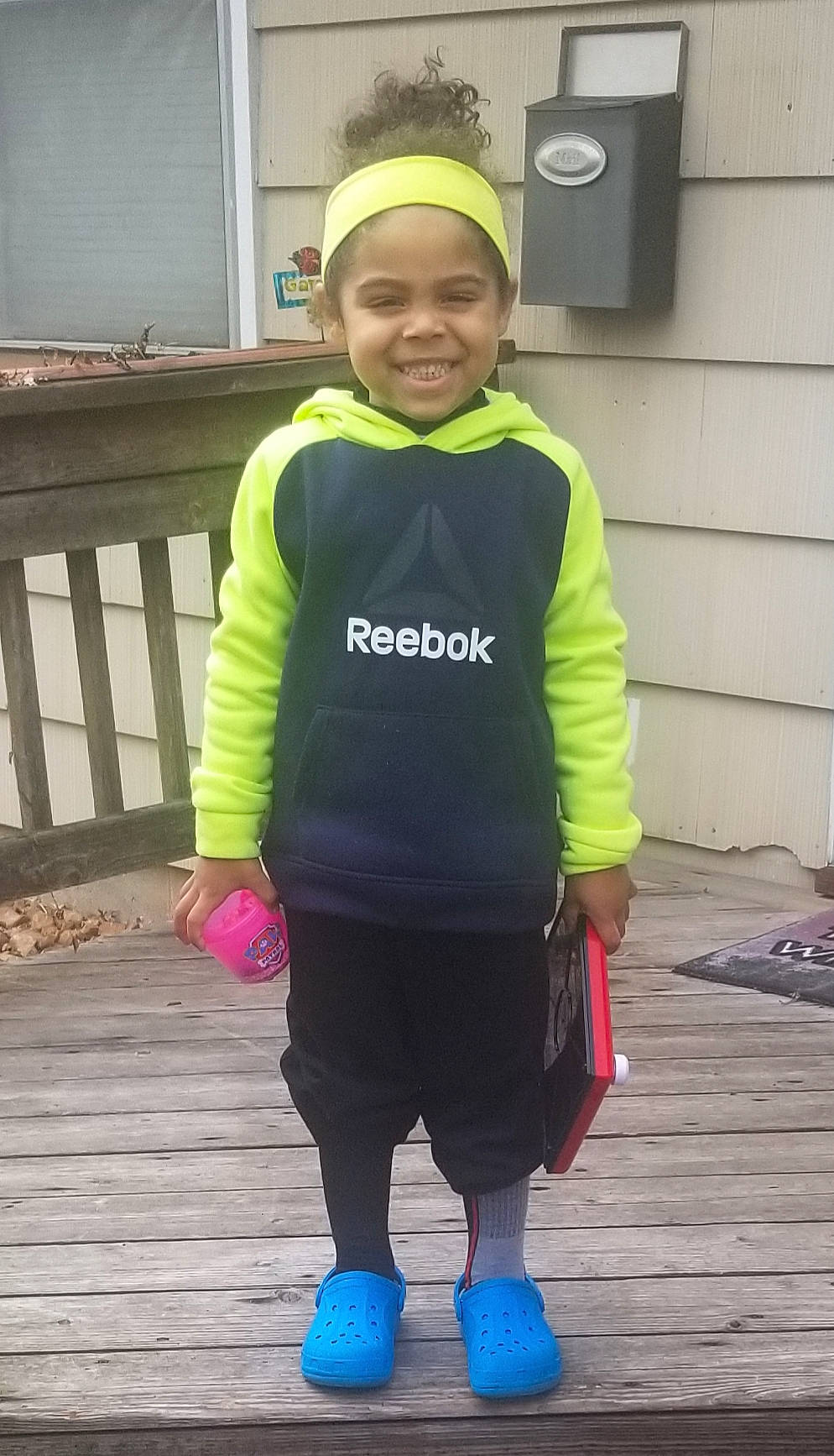 Deklyn is registered to the contest to win money with this photo: child, clothing, costume, fun, happy, high_visibility_clothing, hoodie, jacket, joy, outerwear, person, personal_protective_equipment, play, sleeve, smile, sportswear, standing, t_shirt, toddler, vacation