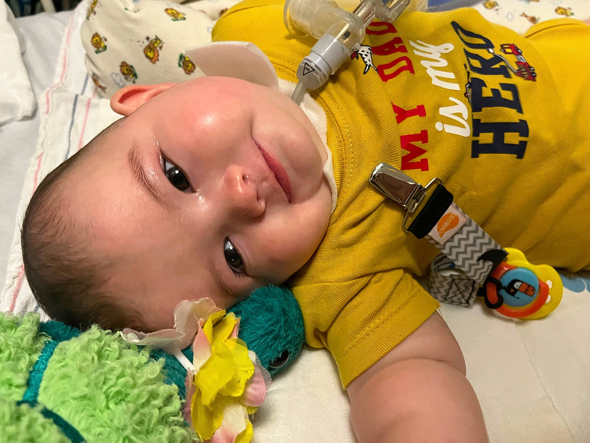 Kaleo is registered to the contest to win money with this photo: baby, baby_toddler_clothing, cheek, eye, eyebrow, eyelash, face, finger, green, head, headgear, human_body, iris, joy, mouth, nose, organ, person, skin, textile