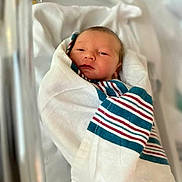 Kingston is registered to the contest to win money with this photo: baby, bassinet, bed, blanket, child, cute, face, fresh, healthcare, hospital, infant, newborn, newborn_baby, person, resting, sleeping, soft, swaddled, wrapped, young