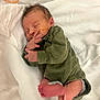 newborn, baby, infant, sleeping, medical_tube, hospital, blanket, green_clothing, cute, small, peaceful, delicate, bed, rest, child, person, indoors, skin, foot, hand