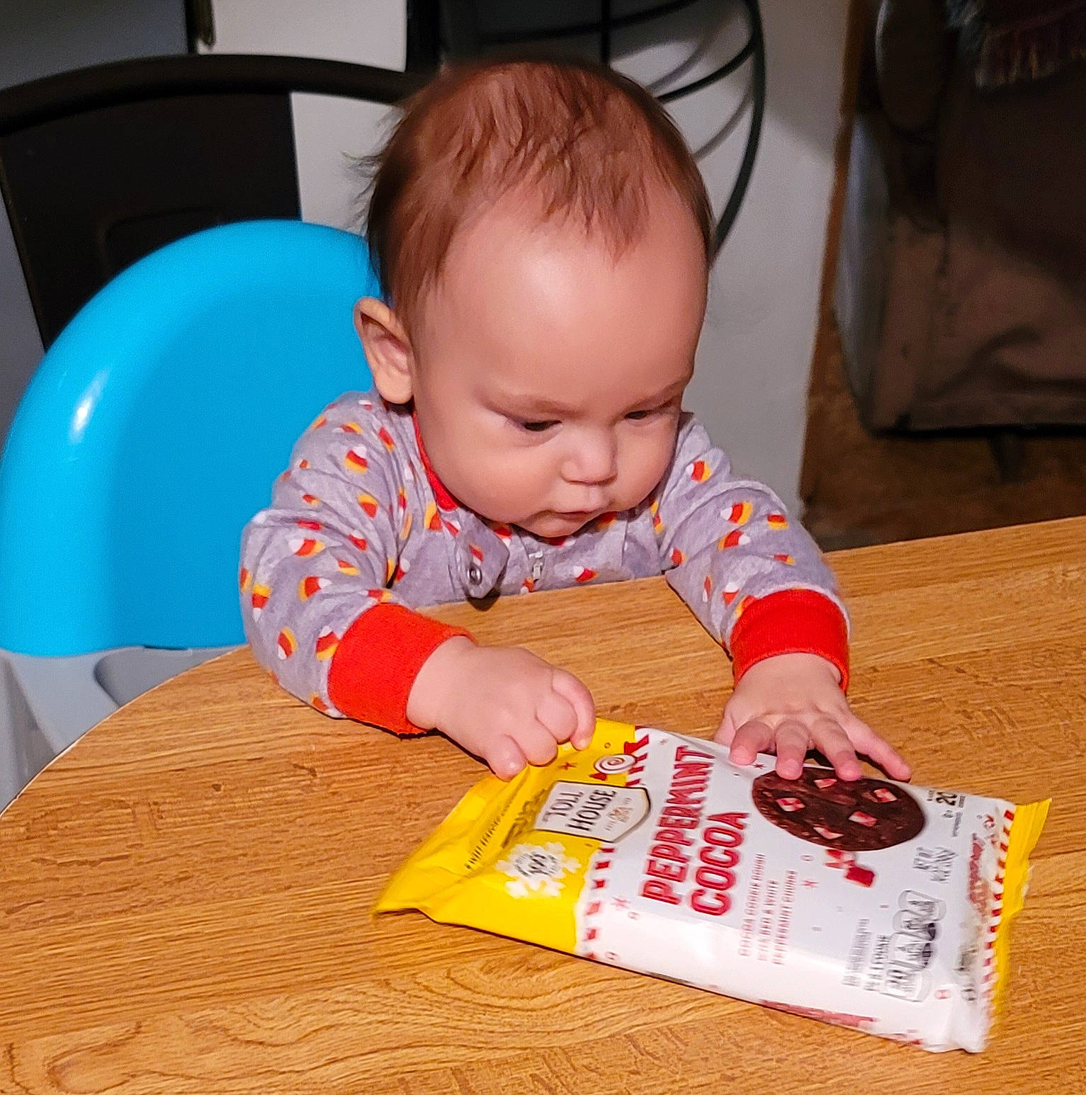 Santino is registered to the contest to win money with this photo: baby, baby_playing_with_toys, baby_toddler_clothing, carmine, chair, child, flooring, font, fun, homework, nail, paper, paper_product, person, play, reading, sharing, sitting, toddler, writing