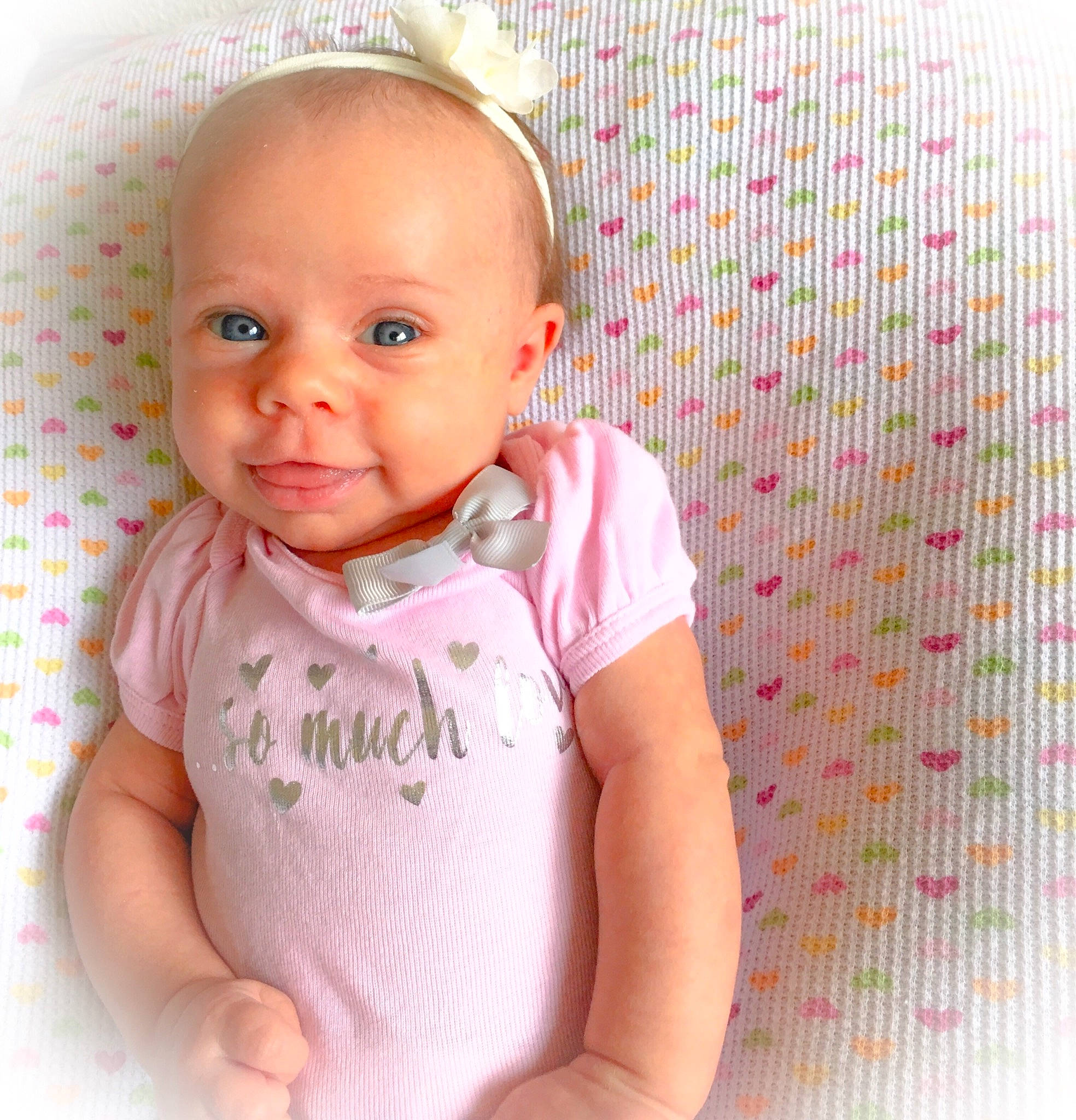 Laynie joined the competition — help win amazing prizes! baby, baby_products, baby_toddler_clothing, cheek, child, face, facial_expression, head, lip, nose, person, pink, product, skin, sleeve, smile, toddler