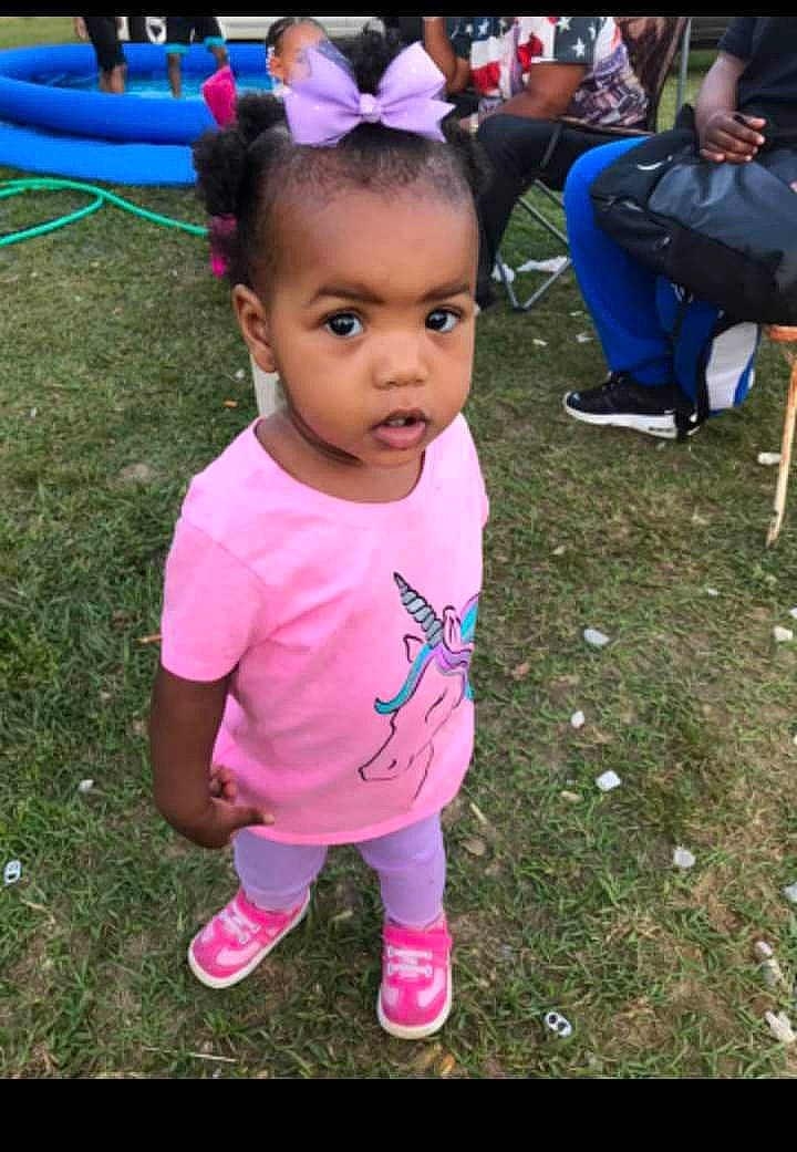 Makenzie joined the competition — help win amazing prizes! baby_toddler_clothing, backpack, bag, blue, child, footwear, grass, happy, leisure, luggage_and_bags, people, person, photograph, pink, purple, recreation, shoe, smile, snapshot, sneakers