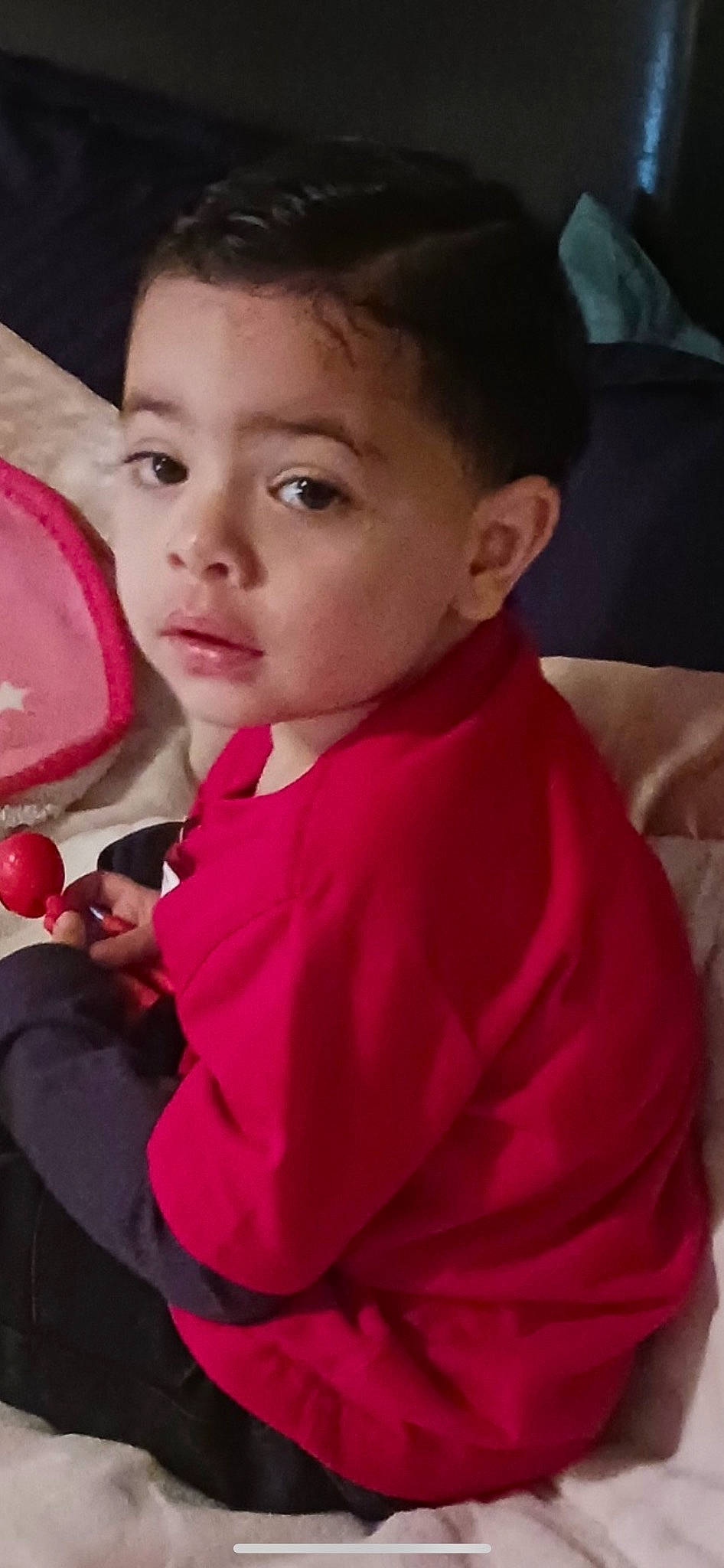 Prince is registered to the contest to win money with this photo: cheek, child, chin, ear, eyelash, forehead, fun, happy, lip, magenta, mouth, neck, nose, person, pink, sitting, skin, sleeve, smile, temple