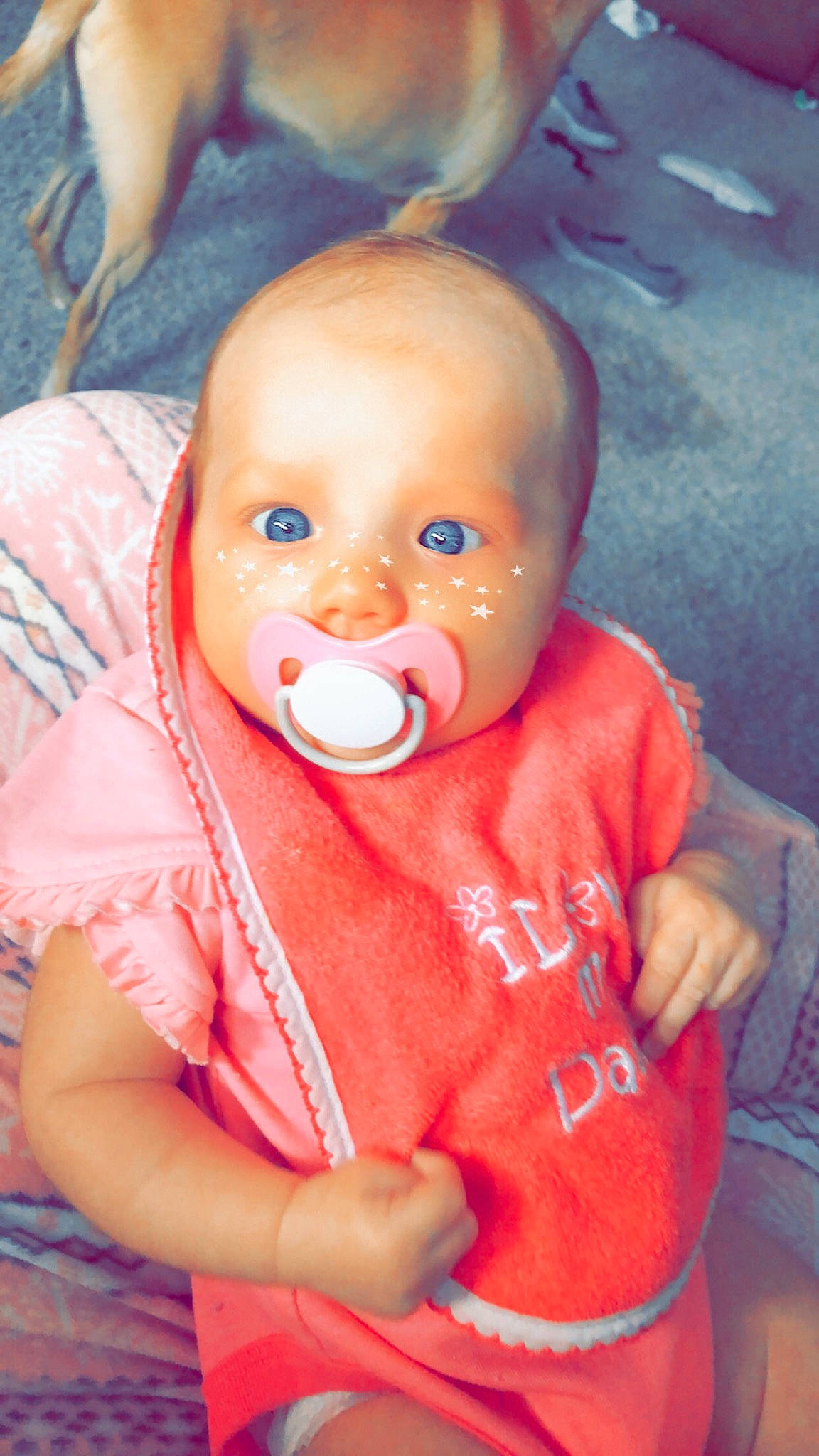 Kensleigh is registered to the contest to win money with this photo: baby, baby_toddler_clothing, cheek, chin, doll, finger, gesture, hand, happy, iris, lip, mouth, nose, orange, person, pink, skin, sleeve, thumb, toddler