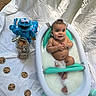 baby, baby_bath, bathtub, child, chocolate_chip_cookies, cookie_monster, cute, happy, infant, milestone, milestone_sign, milk_bath, milky_water, outdoor, photography, plush_toy, smiling, toy, water, white_sheet