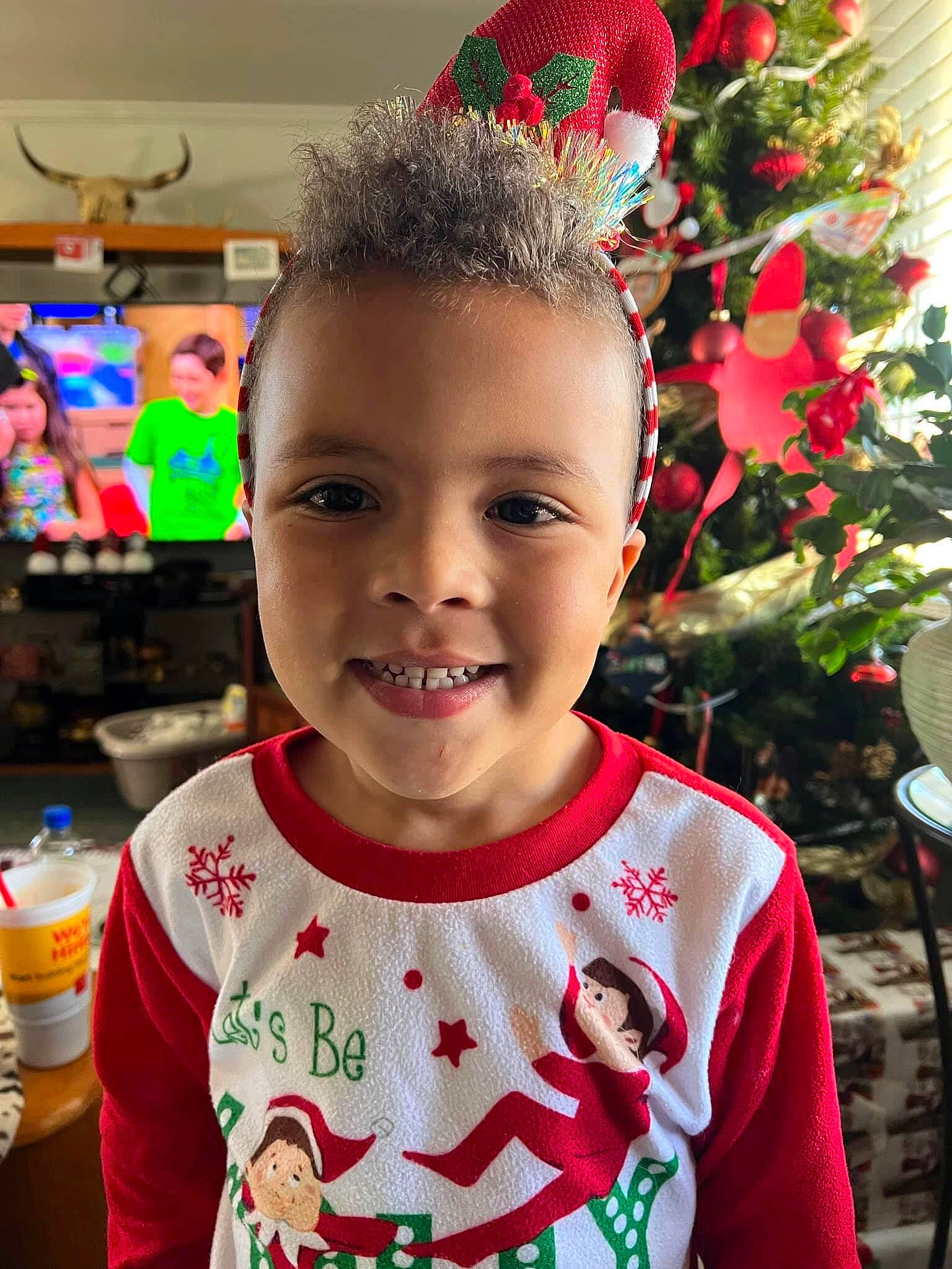 Demari joined the competition — help win amazing prizes! baby_toddler_clothing, beauty, blurred, child, christmas_tree, cool, event, facial_expression, fun, green, happy, holiday, joy, person, plastic_bottle, red, sleeve, smile, standing, t_shirt
