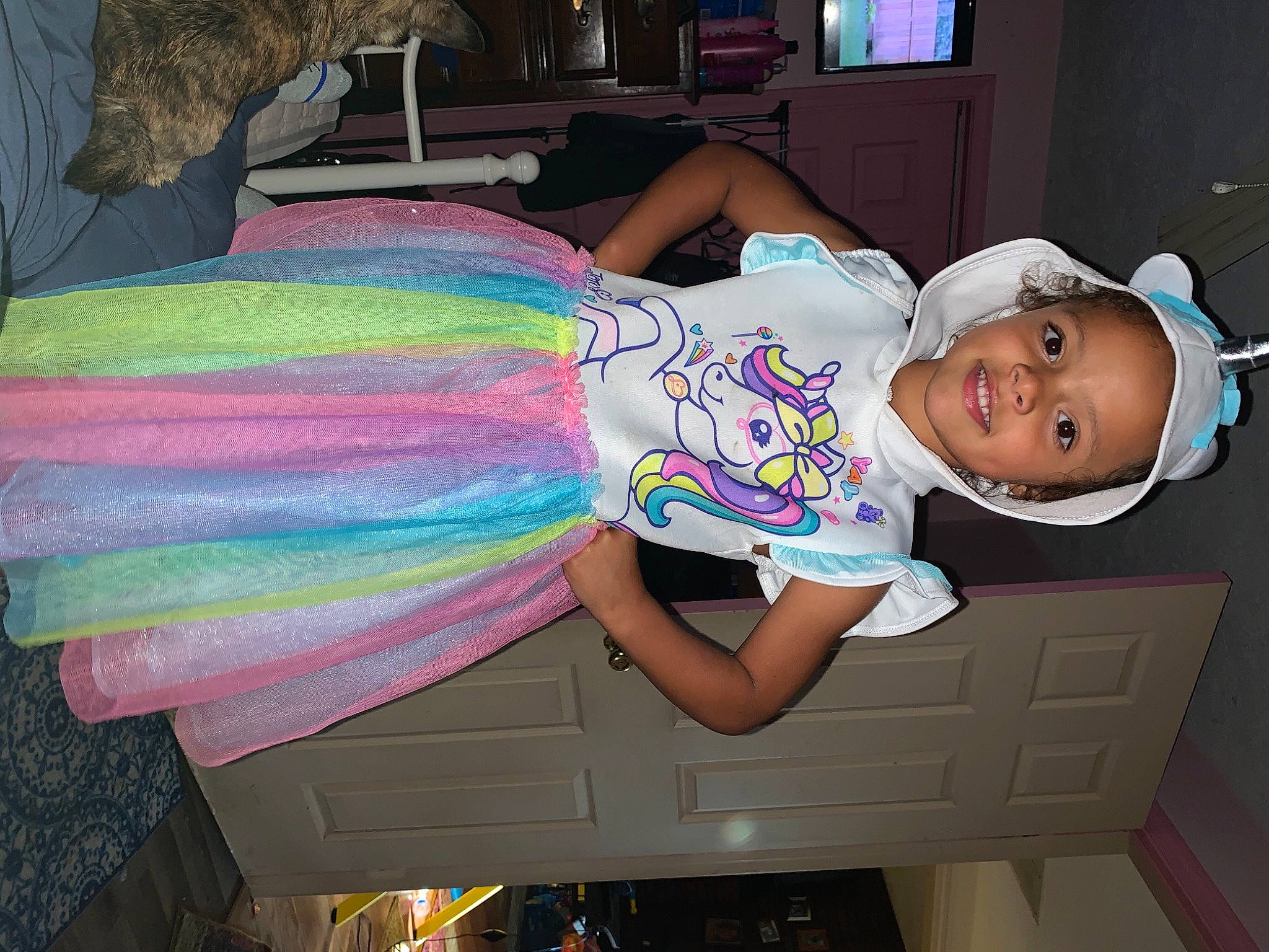 Everlee is registered to the contest to win money with this photo: baby, baby_toddler_clothing, child, facial_expression, fun, happy, hat, headwear, human_leg, joy, leisure, magenta, pattern, person, pink, product, sandal, smile, sun_hat, thigh