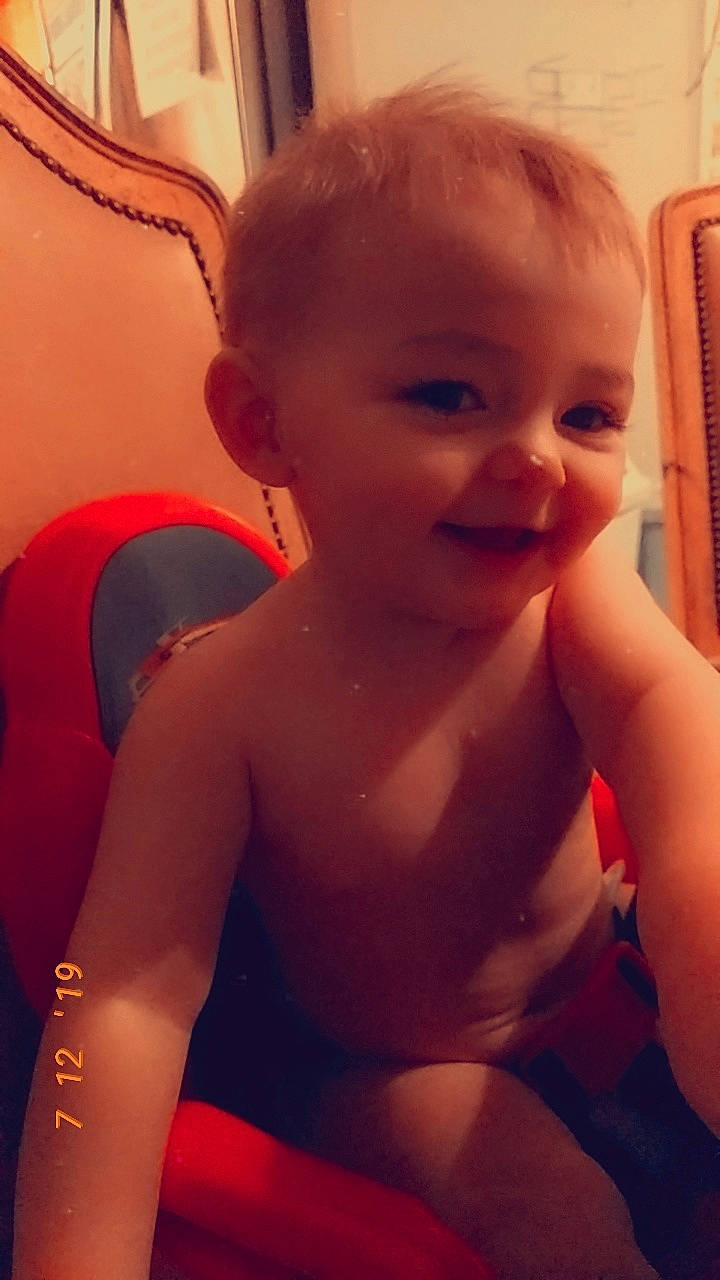 Remington is registered to the contest to win money with this photo: arm, cheek, child, ear, eye, eyebrow, face, facial_expression, forehead, head, joint, leg, lip, mouth, neck, nose, organ, person, shoulder, skin