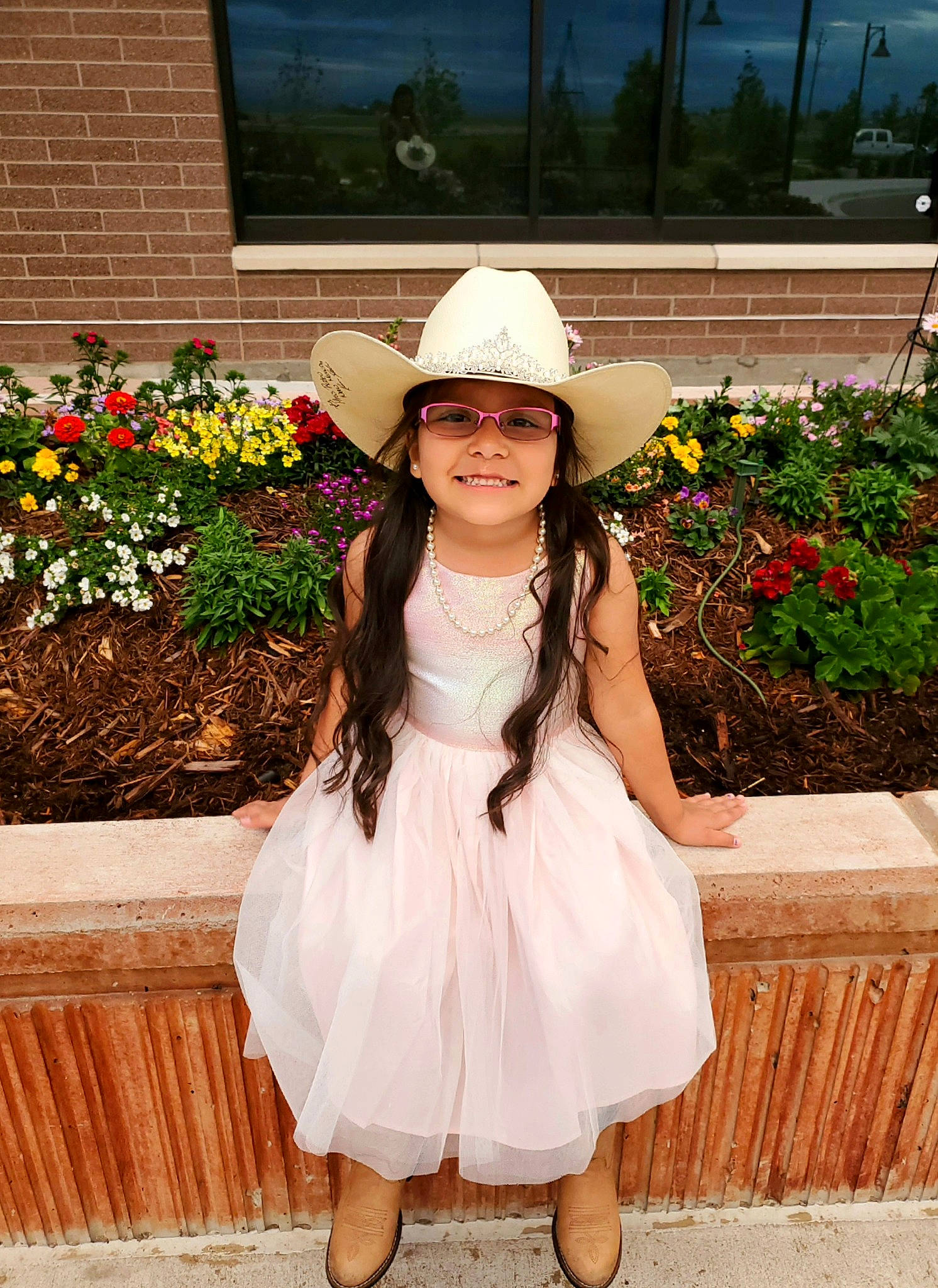 Makynlie joined the competition — help win amazing prizes! child, child_model, clothing, dress, fashion_accessory, flower, flower_girl, hair_accessory, hat, headgear, headwear, joy, person, pink, plant, smile, sun_hat, toddler, white