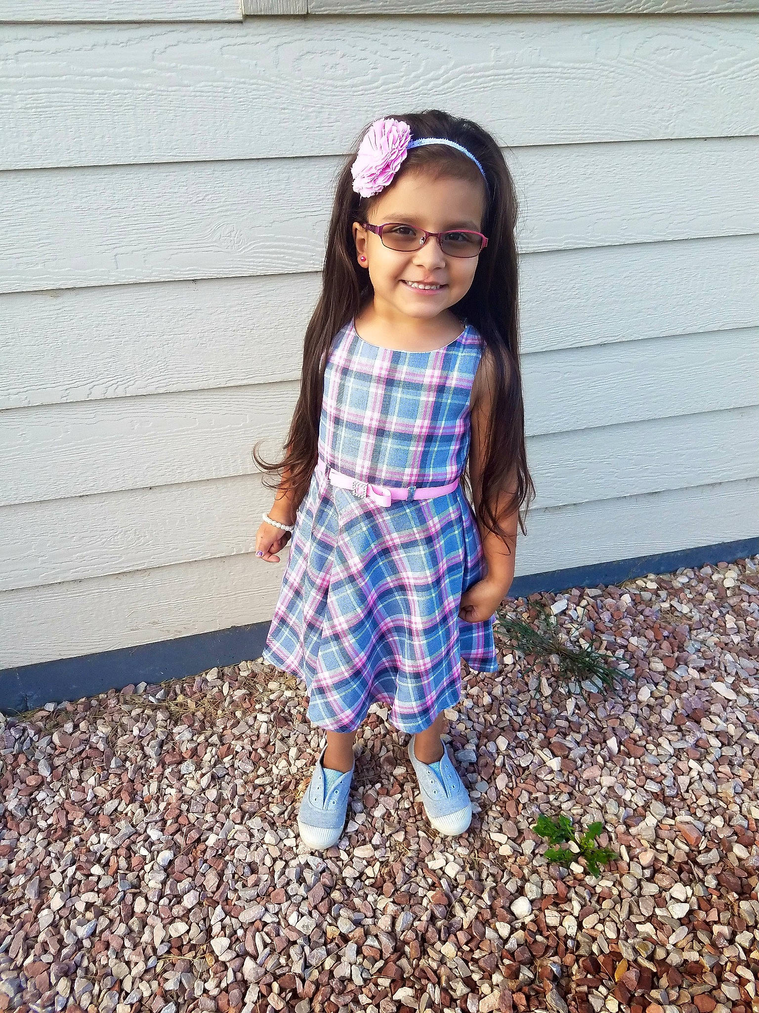 Makynlie is registered to the contest to win money with this photo: child, clothing, denim, design, dress, eyewear, footwear, glasses, headgear, joy, leaf, pattern, person, pink, plaid, shoe, smile, t_shirt, tartan, textile