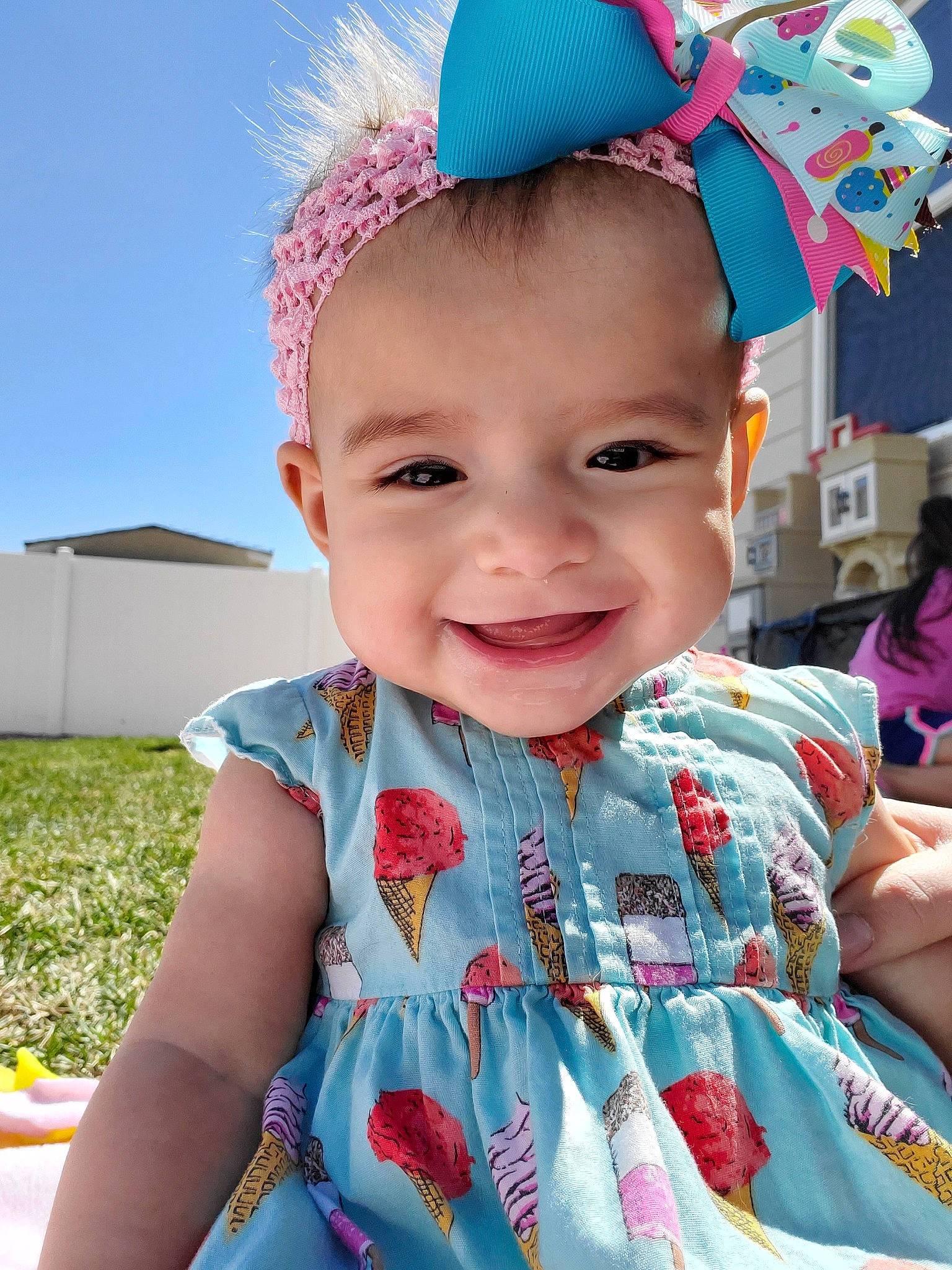 Alyvian is registered to the contest to win money with this photo: baby, baby_toddler_clothing, beauty, cheek, child, dress, face, fashion_accessory, fun, hair_accessory, happy, head, headgear, joy, neck, person, pink, skin, smile, summer