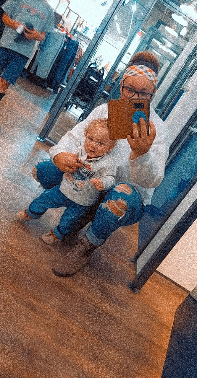 Makoa is registered to the contest to win money with this photo: art, baby, bag, boot, denim, flooring, fun, hardwood, jeans, laminate_flooring, leg, leisure, luggage_and_bags, person, sitting, sneakers, sock, t_shirt, toddler, wood