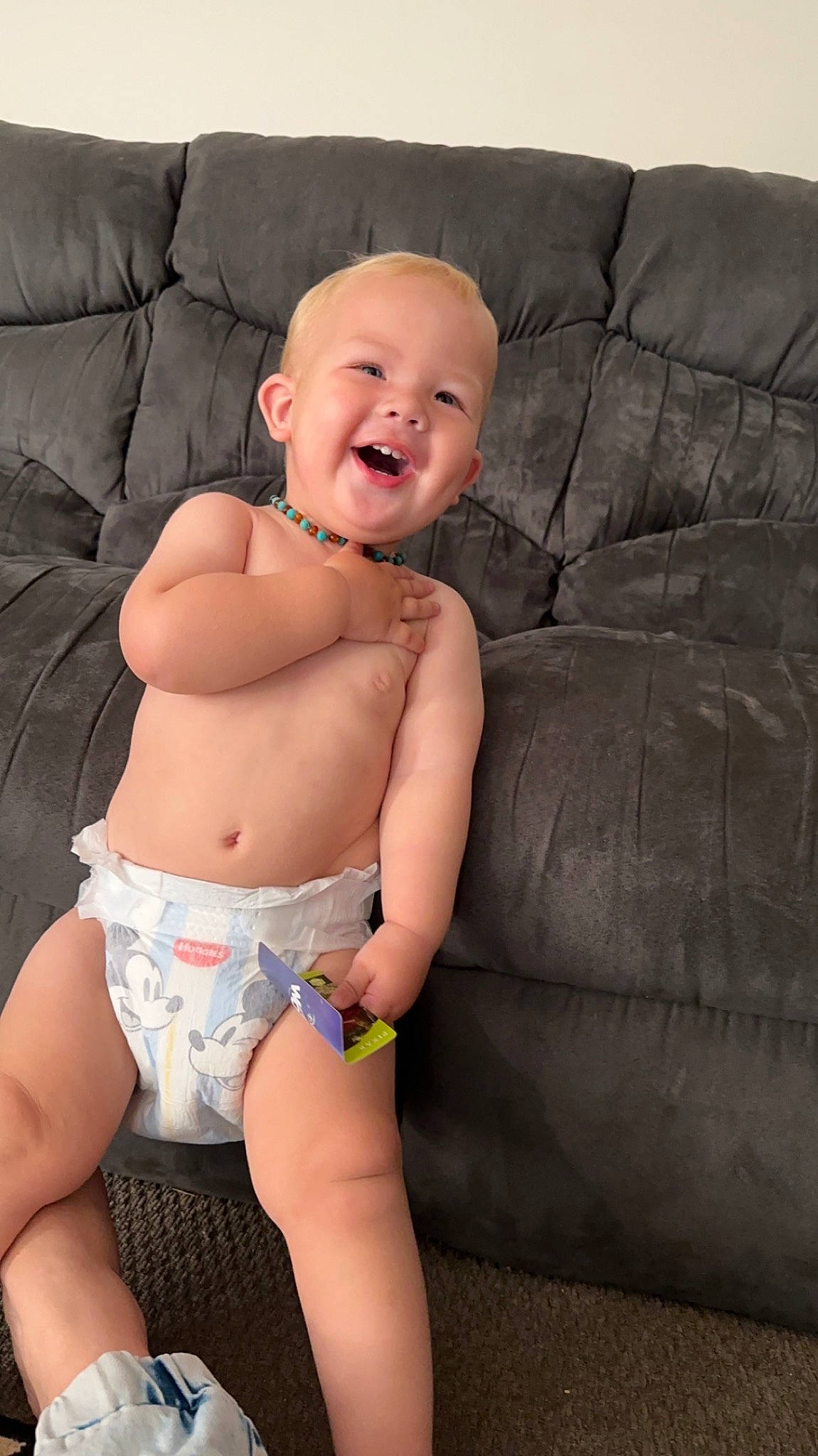 Colby is registered to the contest to win money with this photo: chest, comfort, couch, eye, finger, human_body, knee, leg, lip, mouth, neck, person, skin, smile, stomach, swimwear, thigh, toddler, undergarment, underpants