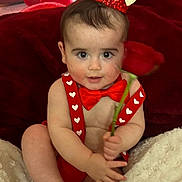 Axton is registered to the contest to win money with this photo: baby, child, red_crown, red_bow_tie, red_suspender, rose, balloons, fluffy_blanket, heart_shapes, indoor, portrait, cute, smiling, celebration, festive, holiday, valentines_day, soft_texture, infant, happy