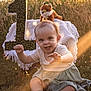 Savannah joined the competition — help win amazing prizes! baby, child, grass, outdoor, sunlight, plush_toy, fox, number_one, blanket, smiling, happy, cute, sitting, nature, greenery, warm_light, portrait, soft_clothing, first_birthday, playful