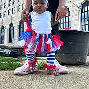 Esperanza joined the competition — help win amazing prizes! adult_hands, baby, building, child, city, crocs, fashion, feet, hands, headband, legs, outdoor, person, sandals, sidewalk, striped_leggings, support, toddler, tutu, urban