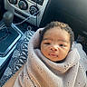 baby, blanket, calm, car, car_interior, car_seat, child, close_up, cozy, dashboard, face, gear_shift, indoor, infant, knitted, looking_at_camera, portrait, stereo, vehicle, wrapped