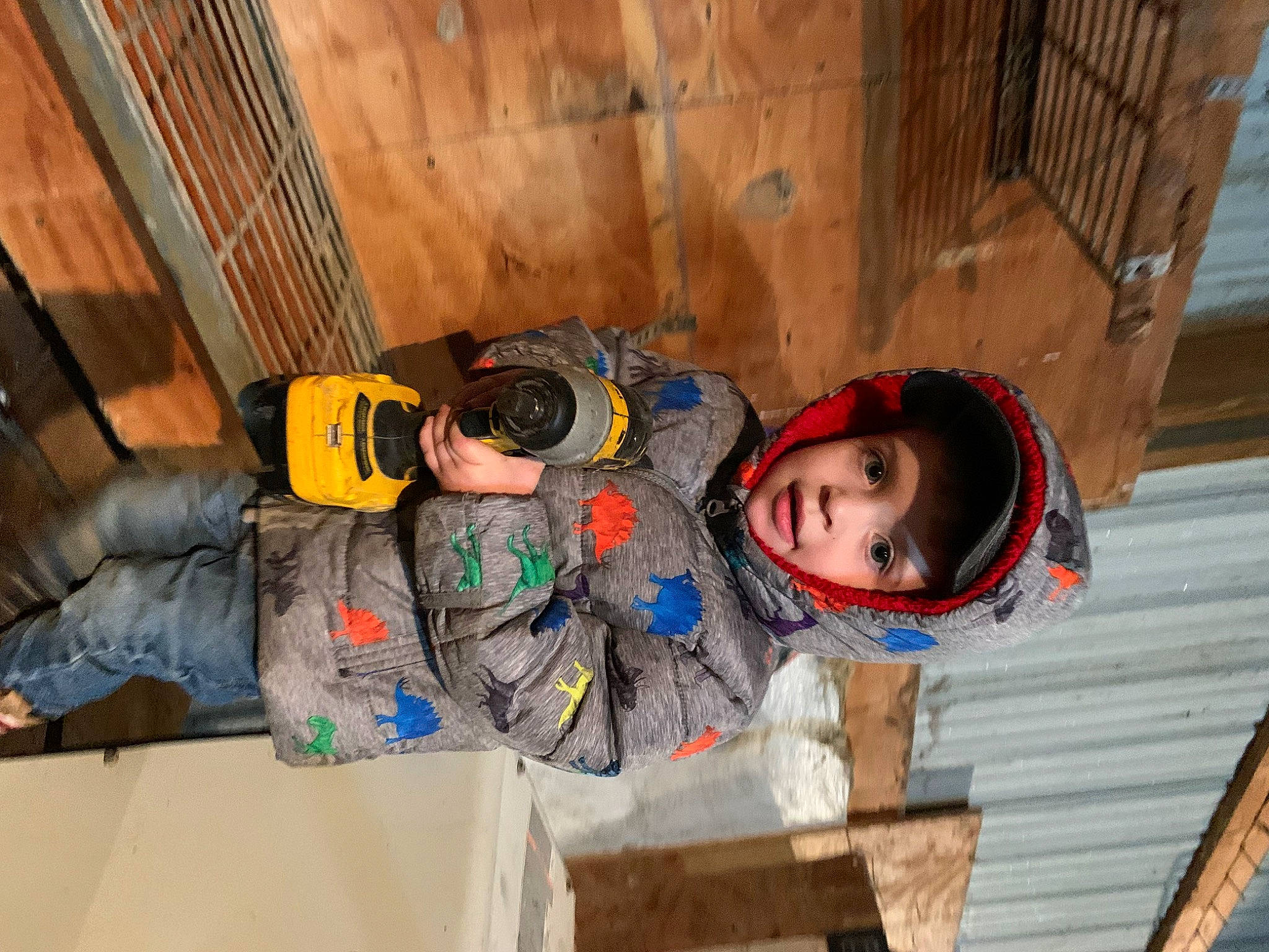 Daxton joined the competition — help win amazing prizes! bag, child, fun, headwear, hoodie, house, jacket, leisure, luggage_and_bags, outerwear, person, personal_protective_equipment, play, room, sitting, toddler, vacation, winter, wood