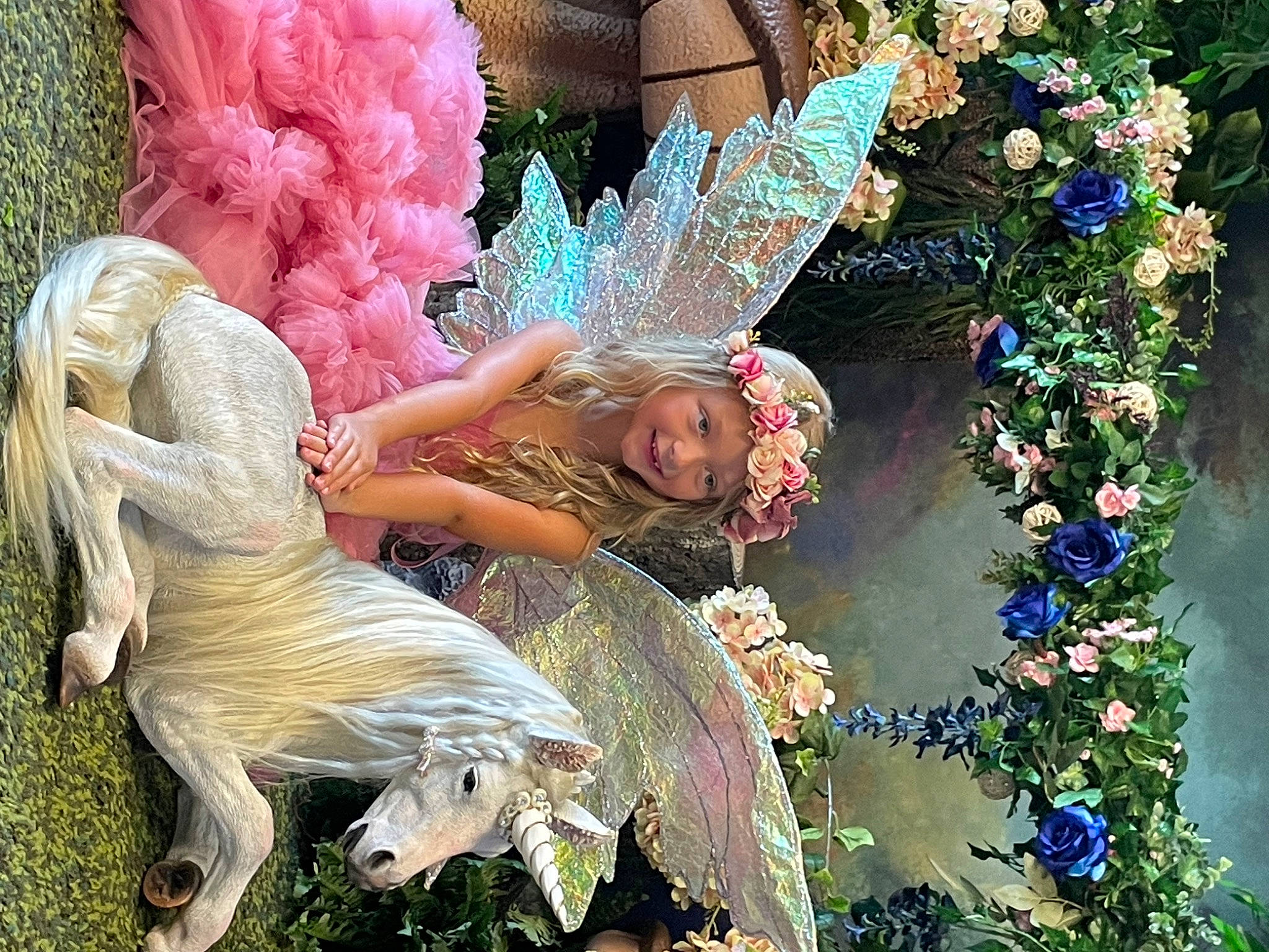 Kinsley joined the competition — help win amazing prizes! angel, art, botany, costume_design, entertainment, event, feather, festival, fictional_character, floral_design, fun, garden, headpiece, headwear, joy, lawn_ornament, mythology, organism, performing_arts, person