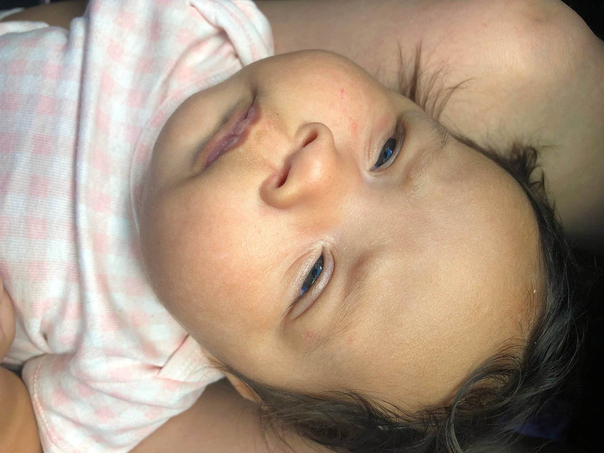 Aubrey is registered to the contest to win money with this photo: baby, baby_toddler_clothing, bedtime, cheek, comfort, ear, eyebrow, eyelash, flash_photography, gesture, happy, iris, jaw, lip, mouth, nap, neck, nose, person, skin