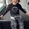 Bailey joined the competition — help win amazing prizes! child, smiling, sweatshirt, jeans, distressed_jeans, brown_shoes, long_hair, casual_clothing, portrait, fashion, happy, young, kid, seated, indoor, blurry_background, cute, trendy, person, clothing