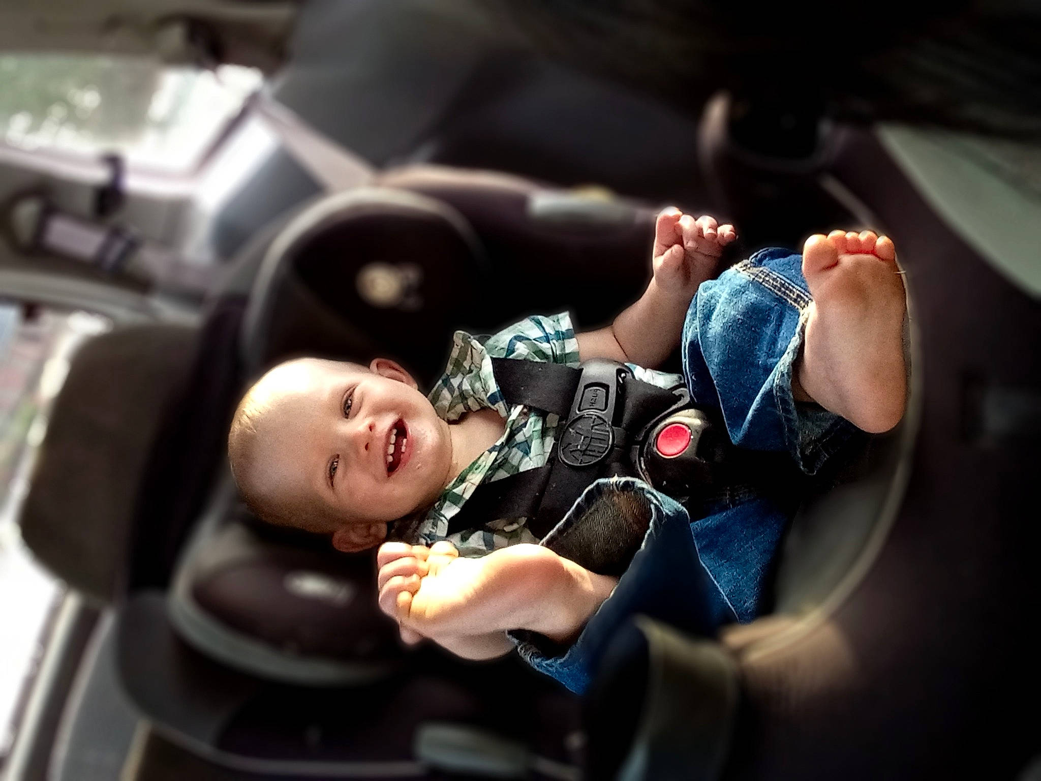 Asher is registered to the contest to win money with this photo: auto_part, automotive_design, automotive_exterior, automotive_tire, baby, baby_products, car_seat, child, comfort, family_car, flash_photography, head_restraint, joy, luxury_vehicle, motor_vehicle, person, personal_luxury_car, sitting, steering_wheel, toddler