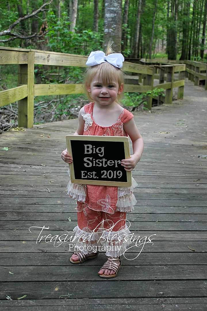 Annalynn joined the competition — help win amazing prizes! child, costume, footwear, joy, natural_environment, person, photography, pink, plant, shoe, smile, toddler, wood