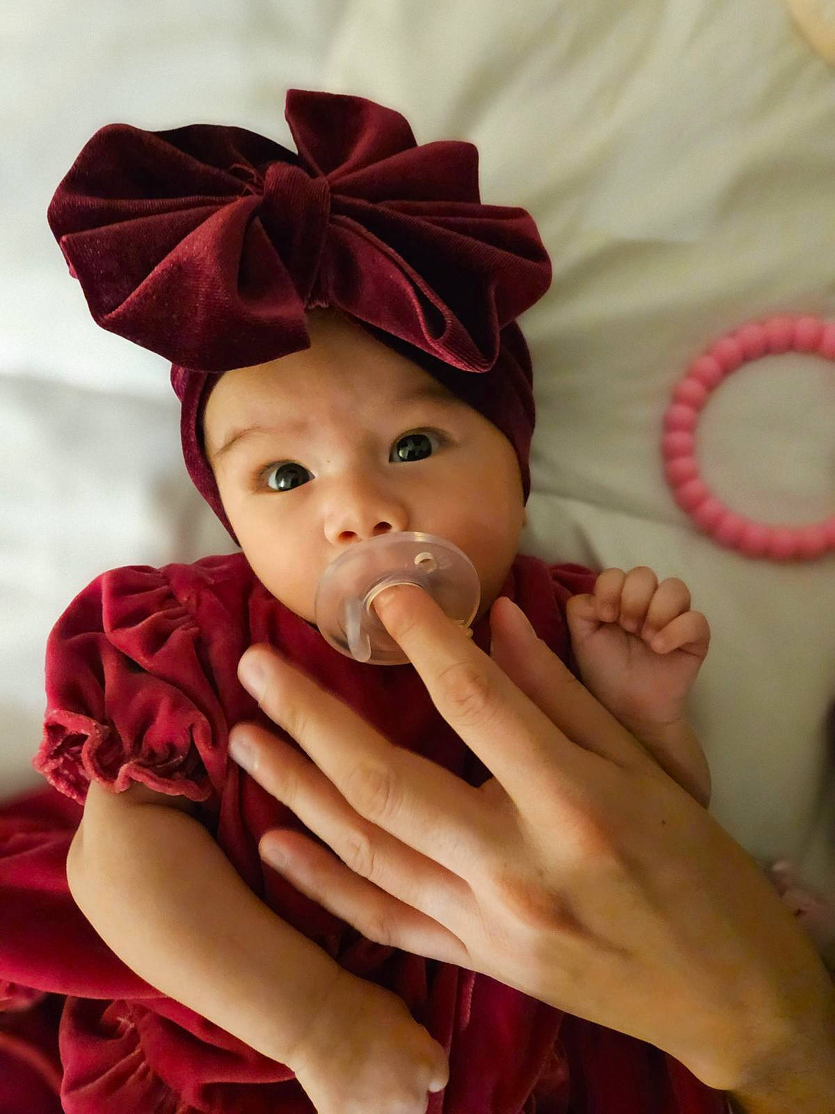 Elianna joined the competition — help win amazing prizes! baby, baby_toddler_clothing, cap, cheek, comfort, eye, eyelash, face, finger, gesture, hand, happy, headgear, headwear, lip, magenta, nail, person, pink, skin